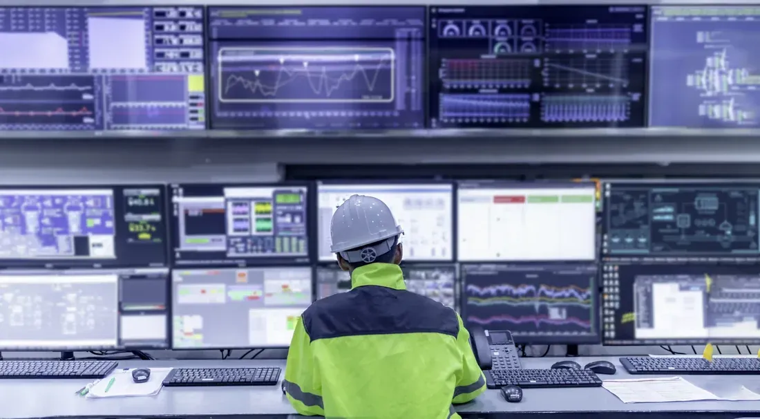 Technician monitoring an operations centre video wall